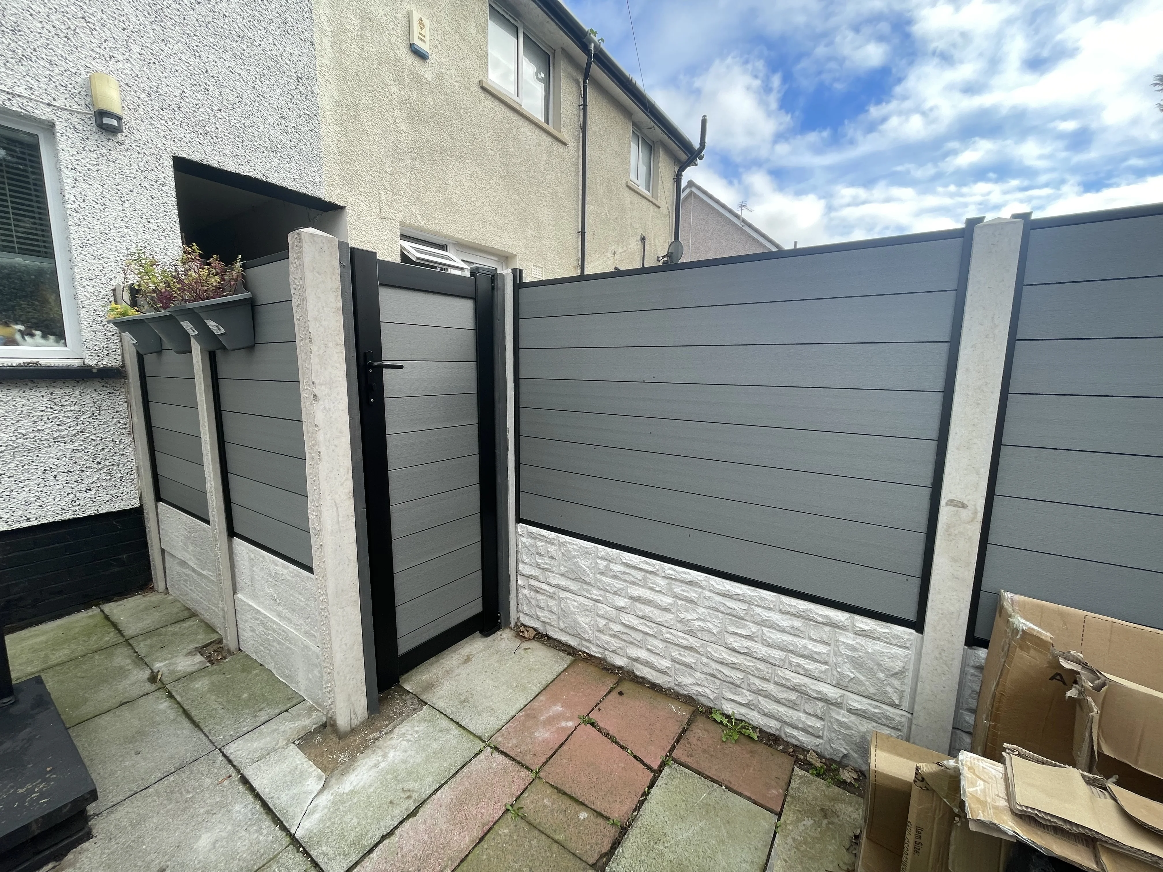 Concrete posts and composite panels with gate installation in Irvine, Ayrshire